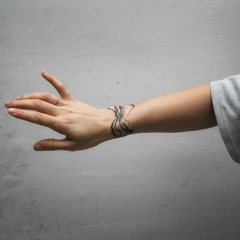 line wrist tattoo