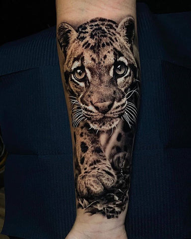 tiger pup tattoo on forearm