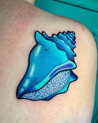 blue seashell conch tattoo on the shoulder