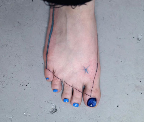 line star foot tattoo