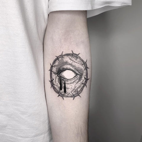Circular tattoo in black tones