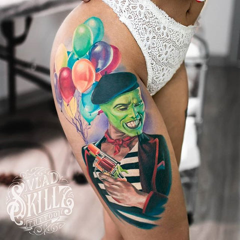 balloon gun tattoo design on the thigh