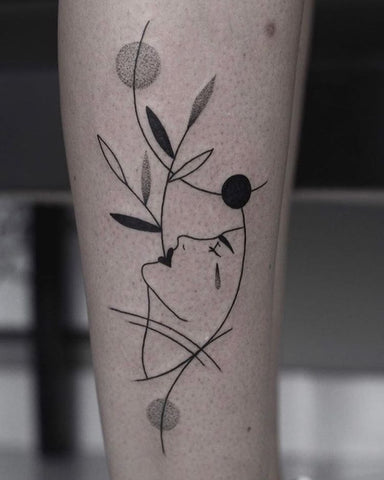 fine line leaf woman portrait leg tattoo