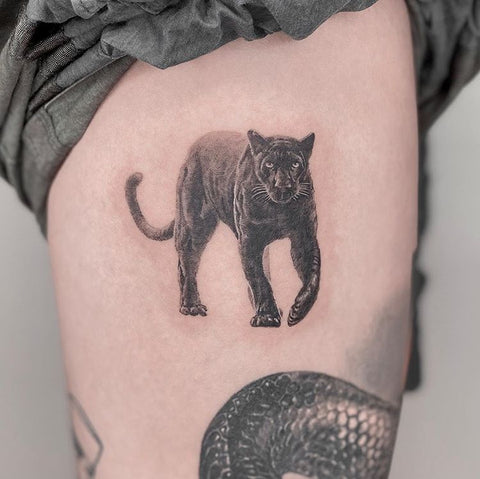 small tiger leopard thigh tattoo