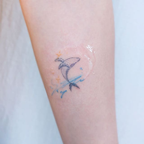 simple dolphin forearm tattoo design