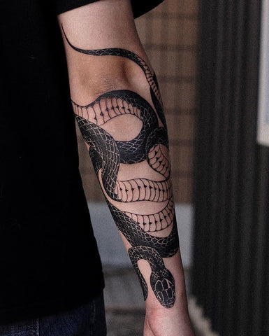 snake elbow tattoo