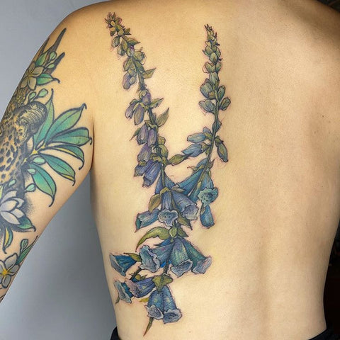 line blue flower back tattoo