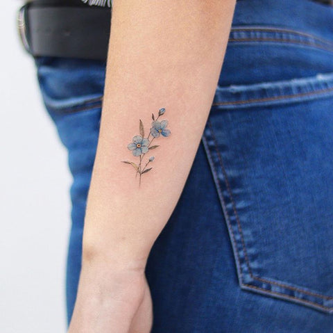 simple flower forearm tattoo