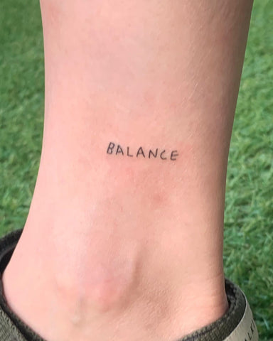word tattoo balance