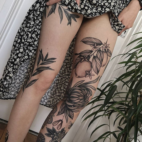 flower plant leg tattoo