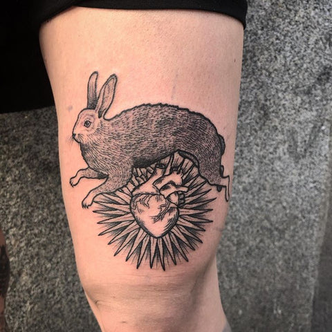 rabbit and heart tatoo on thigh