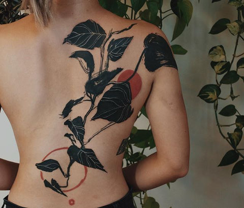 leaf plant full back tattoo