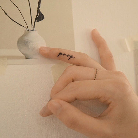 word finger tattoo