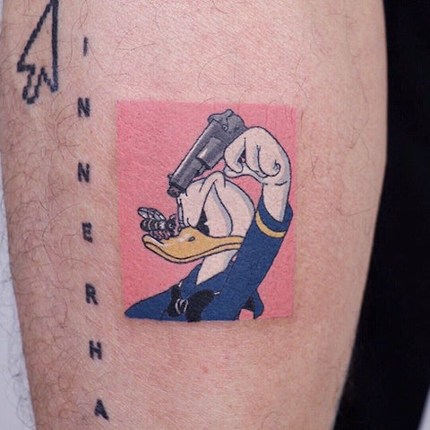 Donald Duck with a gun and a bee tattoo