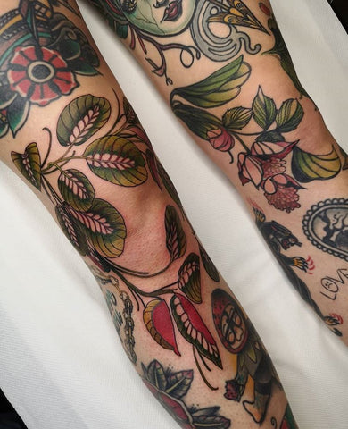 flower plant full leg tattoo