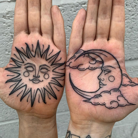 sun and moon hand tattoo