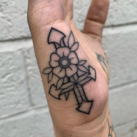 flower cross hand tattoo