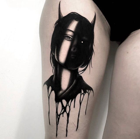 black demon woman portrait thigh tattoo