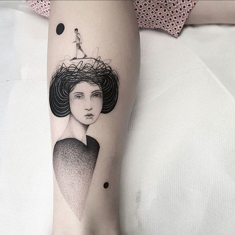 woman portrait leg tattoo