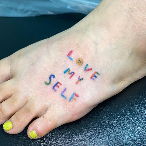 colorful word tattoo