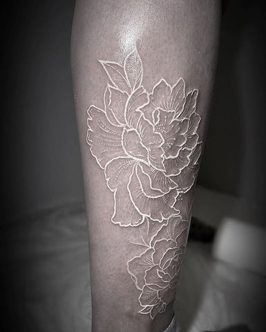 flower white ink tattoo