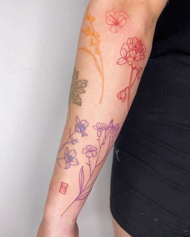 fine line flower tattoo
