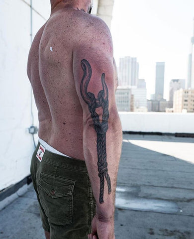 horn rope elbow tattoo