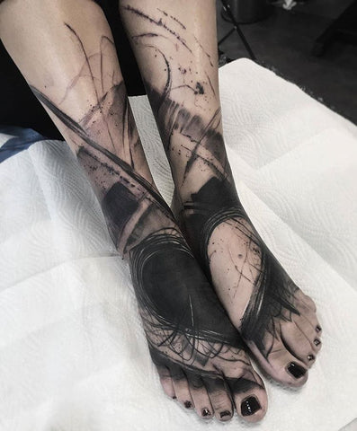 connecting blackout heart foot tattoo