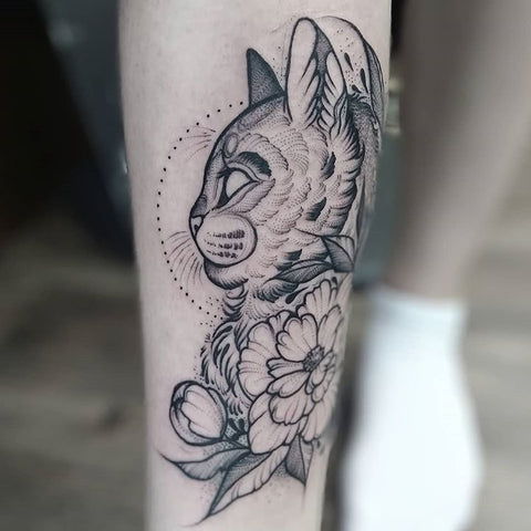 animal cat leg tattoo