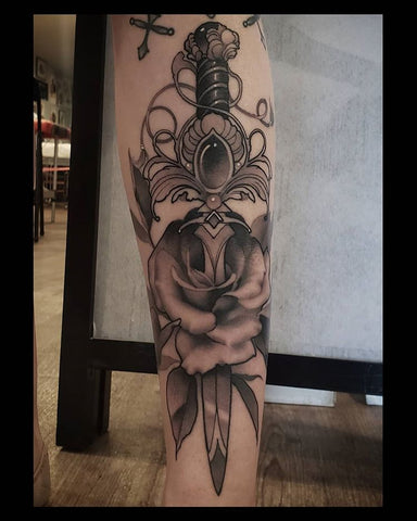 sword flower calf tattoo