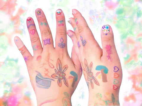 colorful flower tattoo on the back of the hand