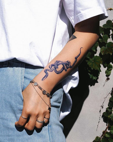 blue snake forearm tattoo