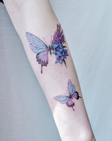 butterfly forearm tattoo