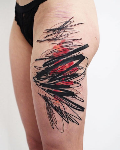 scribble thigh tattoo