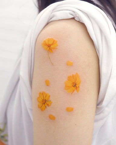 yellow flower tattoo