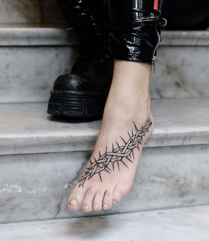 thorn foot tattoo