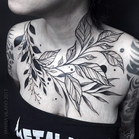 plant leaf chest tattoo