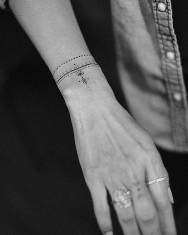 line wrist tattoo