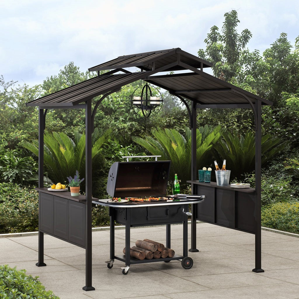 BBQ beneath a Sunjoy Outdoor Patio Backyard Hardtop Grill Gazebo with Metal Ceiling Hook and Bar Shelves