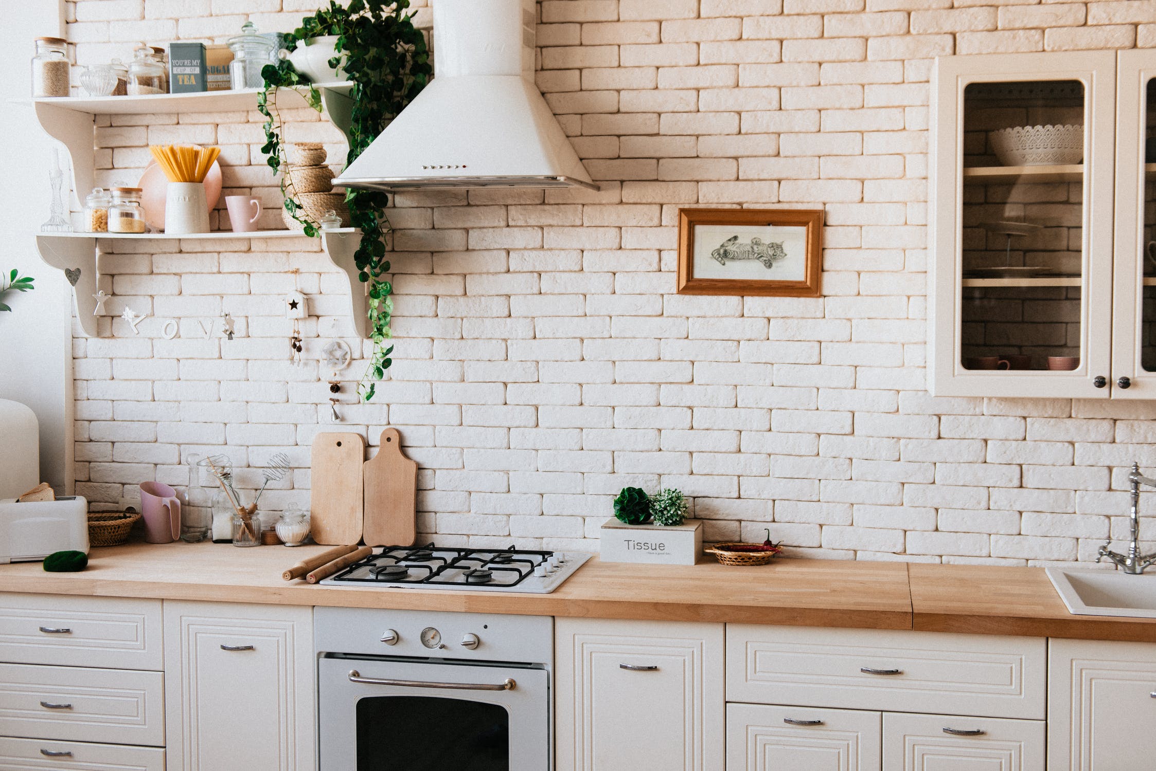 Beige Kitchen Cabinet Industrial Style Dining Room:Two Layers Shelves to Storage Kitchenware,Wall Art Paintings On The Wall,And Tissue Box with Plants As Decoration