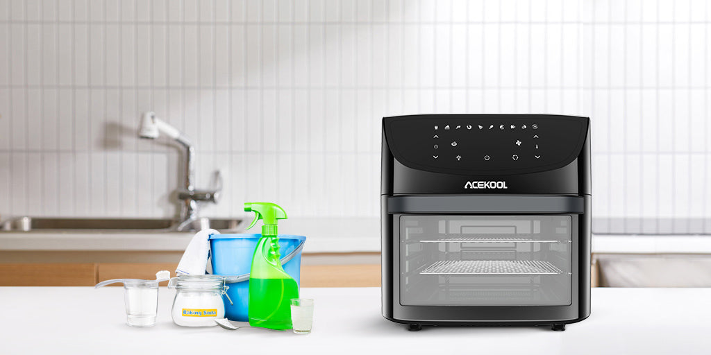 air fryer oven with cleaner on a table beside the sink