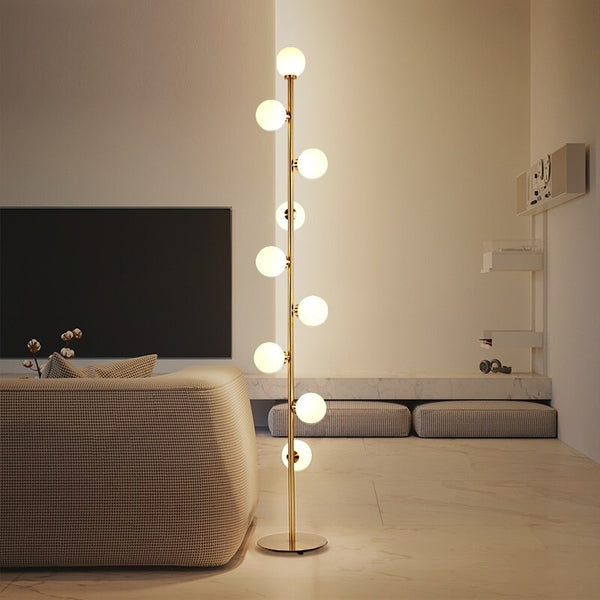 IDEA(HK) LIGHTING - Nucleic - Modern LED standing lamp with frosted glass ball fixtures. Nickel gold plated steel body. Suitable for bedrooms, halls or next to a lonely wall.  9 light sources with a coverage of approximately 6-12 square meters, using the included LED Bulbs. Base diameter: 25cm Glass ball diameter: 10cm Specifications Light Source 9x LED Bulbs Base Type G4 Power Consumption 16-20W Is Bulbs Included Yes Dimmable