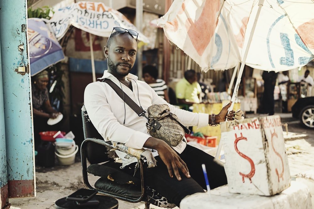 Paint By Numbers | Kinshasa - Man In White Dress Shirt And Black Pants Sitting On Chair