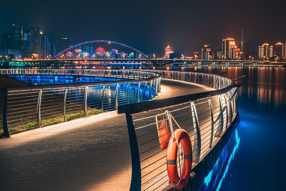 Paint By Numbers | Mianyang - Curve Road With Railings Near Buildings With Lights At Night