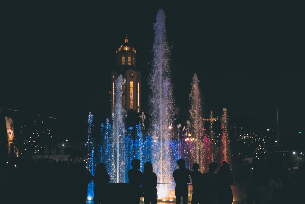 Paint By Numbers | People Standing Near Water Fountain During Night Time