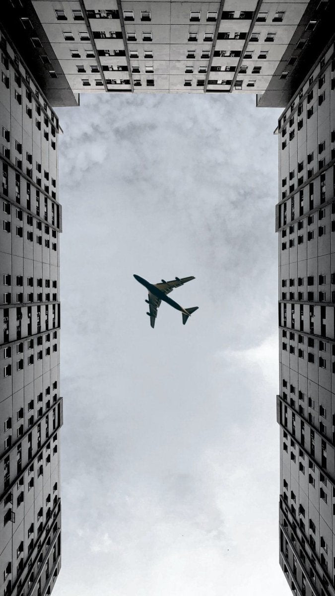 Paint By Numbers | Surabaya - Airplane Flying Over The Building During Daytime