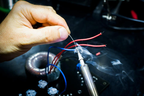 Inspecting the shut-off lever on a refrigerator ice maker machine tray