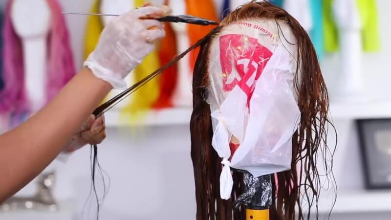 apply dye to wig use small brush section by section