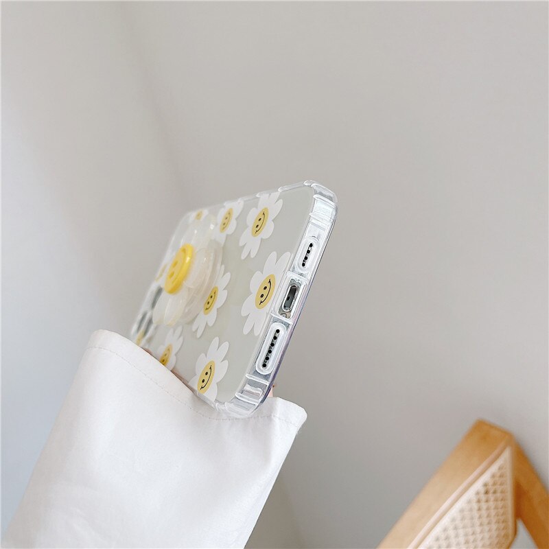 iPhone case with a see-through daisy grip holder