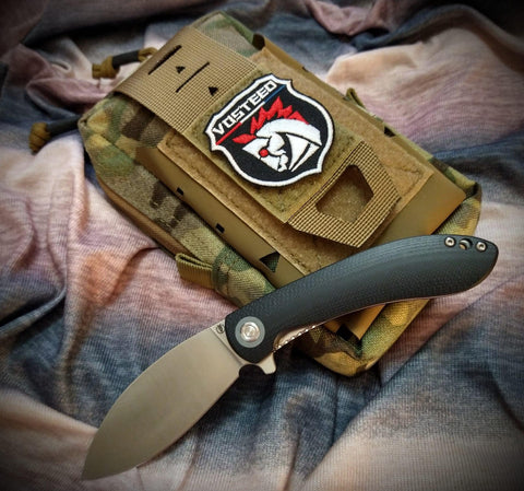 Vosteed EDC Gear: A folding knife with a black handle lies next to a tactical pouch featuring a Vosteed logo patch